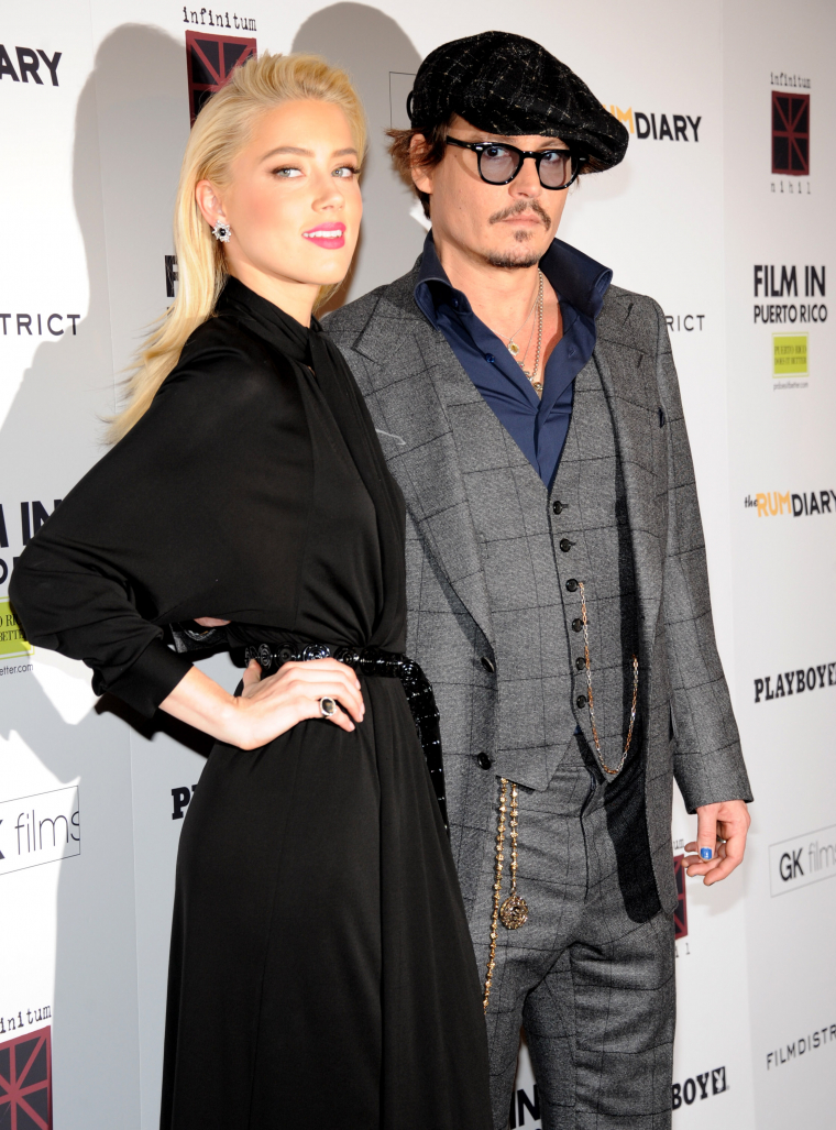 Johnny Depp i Amber Heard podczas konferencji prasowej filmu "Dziennik zakrapiany rumem". Nowy Jork, 25 października 2011.